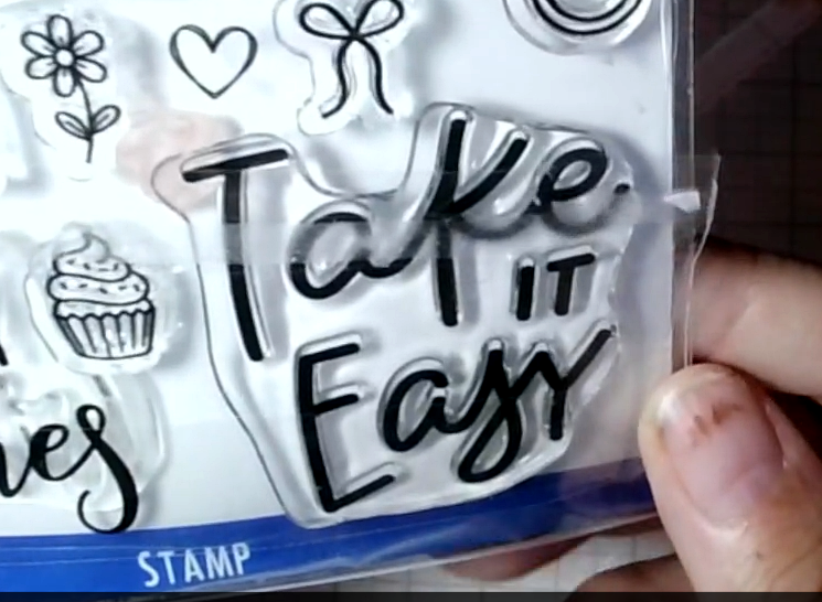A clear stamp featuring the words “Take It Easy”.