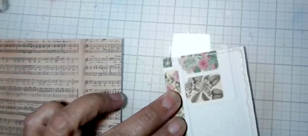A layered paper tag being assembled as a pocket with an opening at the side.