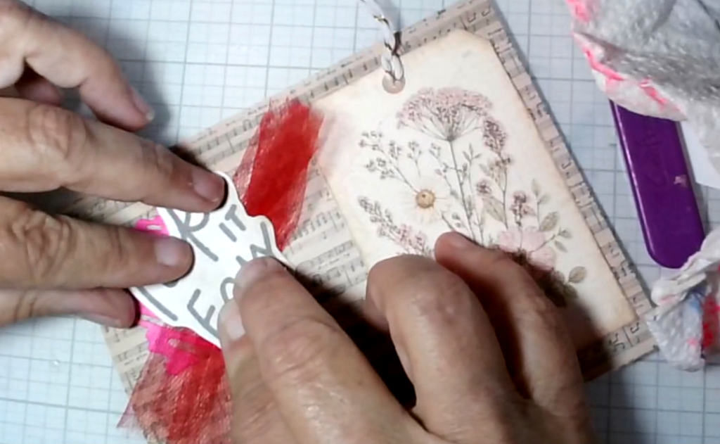 The final red-mesh placement peeking from behind the layered sentiment tag.